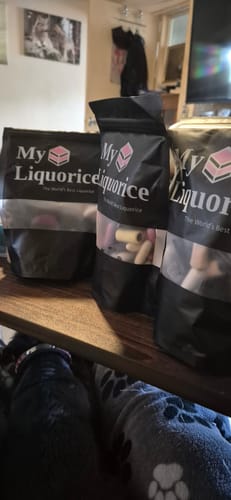 Customer's three bags of Mixed Gourmet Liquorice sitting on a wooden surface.