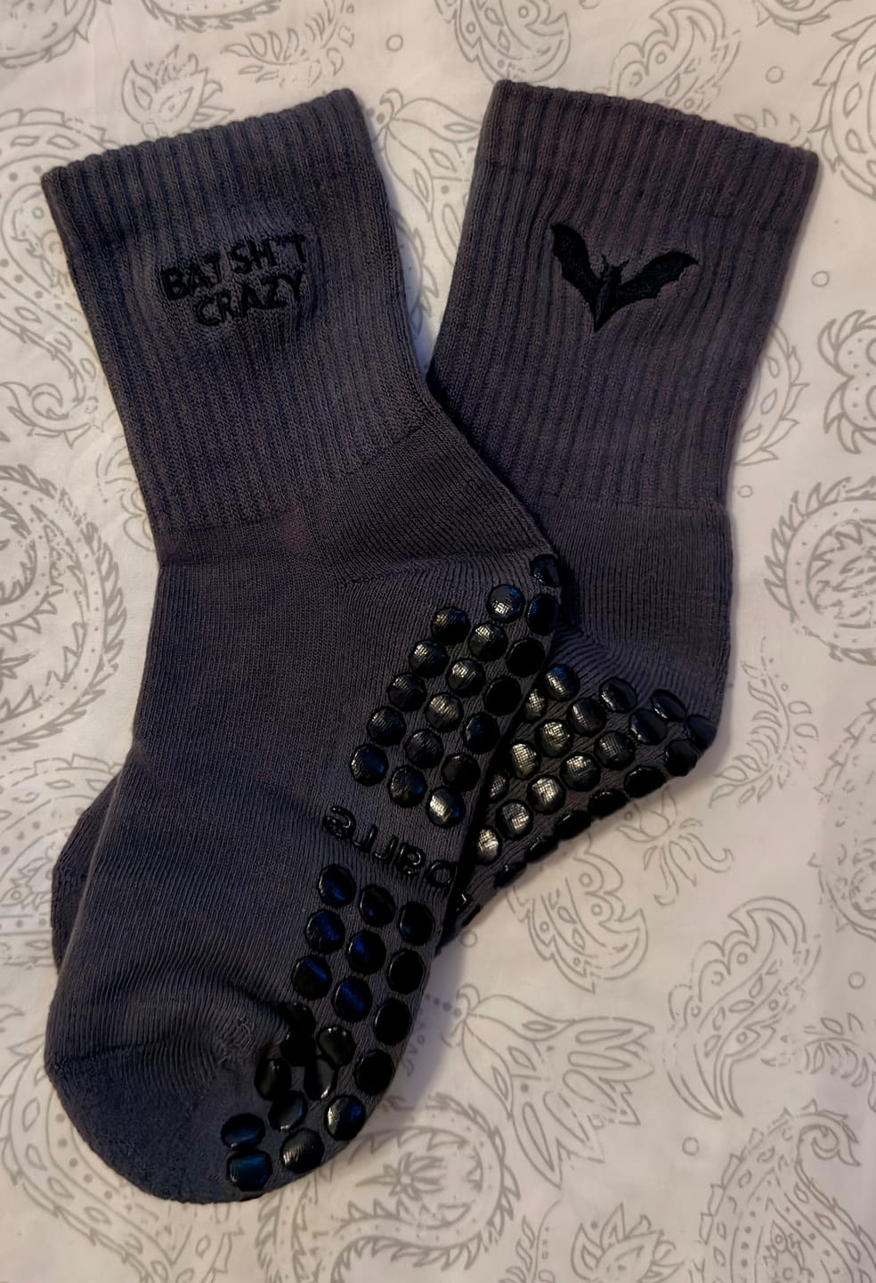 Customer photo review of Bat Sh*t Crazy Halloween Grip Socks