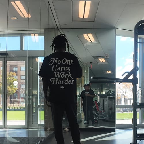 Customer photo review of 'NO ONE CARES WORK HARDER' TEE - JET BLACK