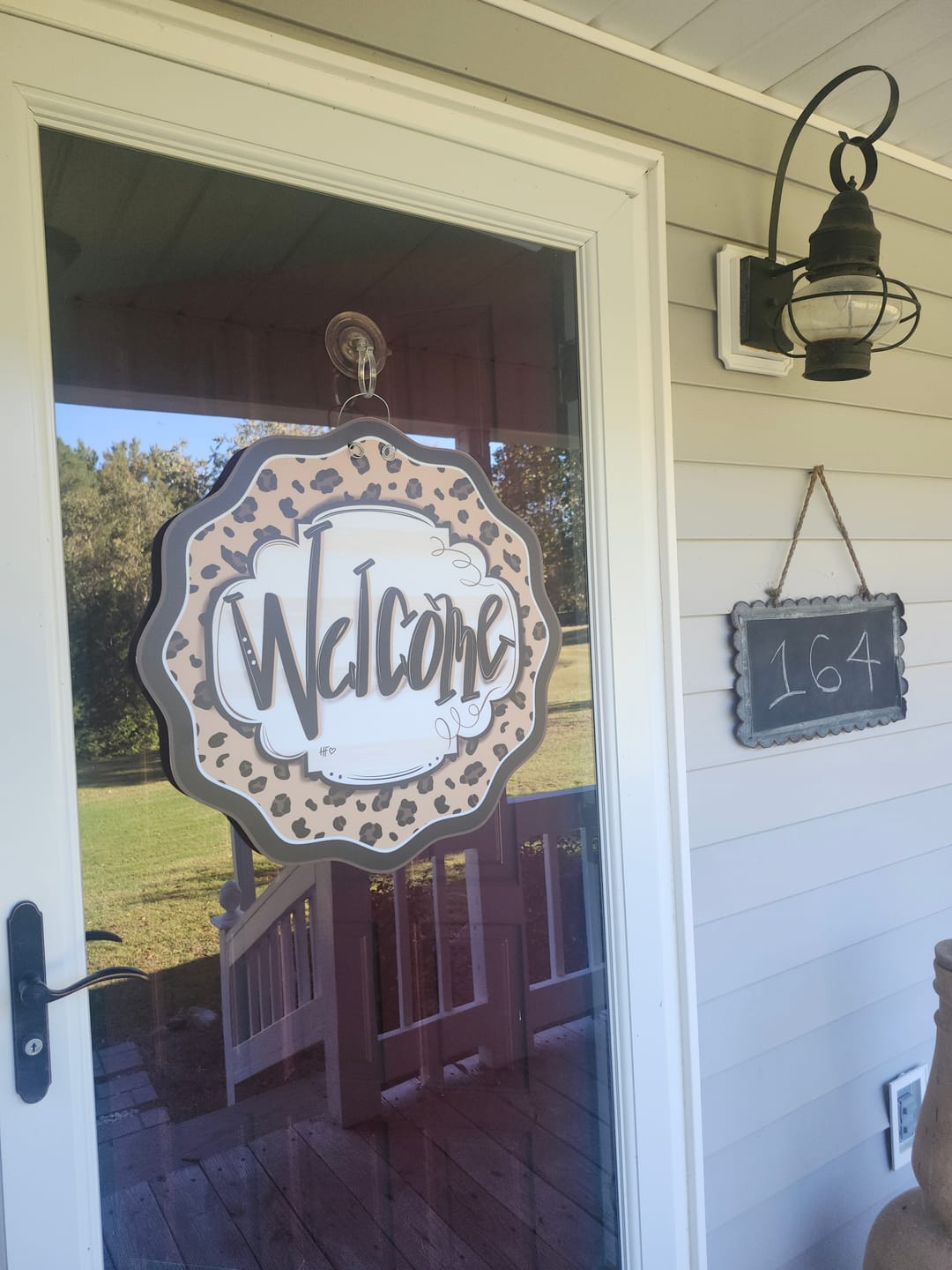 Customer photo review of Leopard Cheetah Welcome Door Hanger