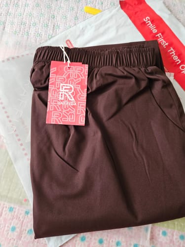 Customer's Raffida Serena BriskWalk Skirt in brown, folded with a brand tag attached, resting on its packaging.