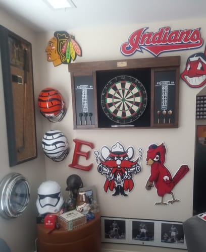Customer's Texas Tech Raider Red metal wall art displayed on a wall in a sports-themed room