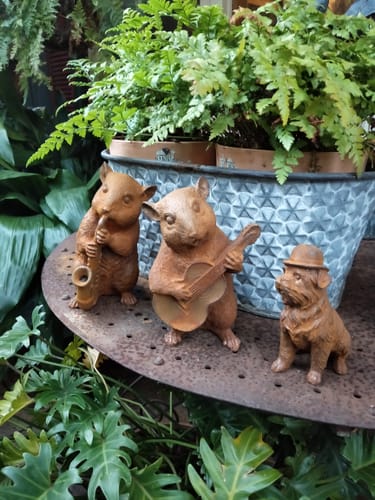 Reviewer's Bertie French Provincial Dormouse statues alongside a small dog statue, displayed in a garden.