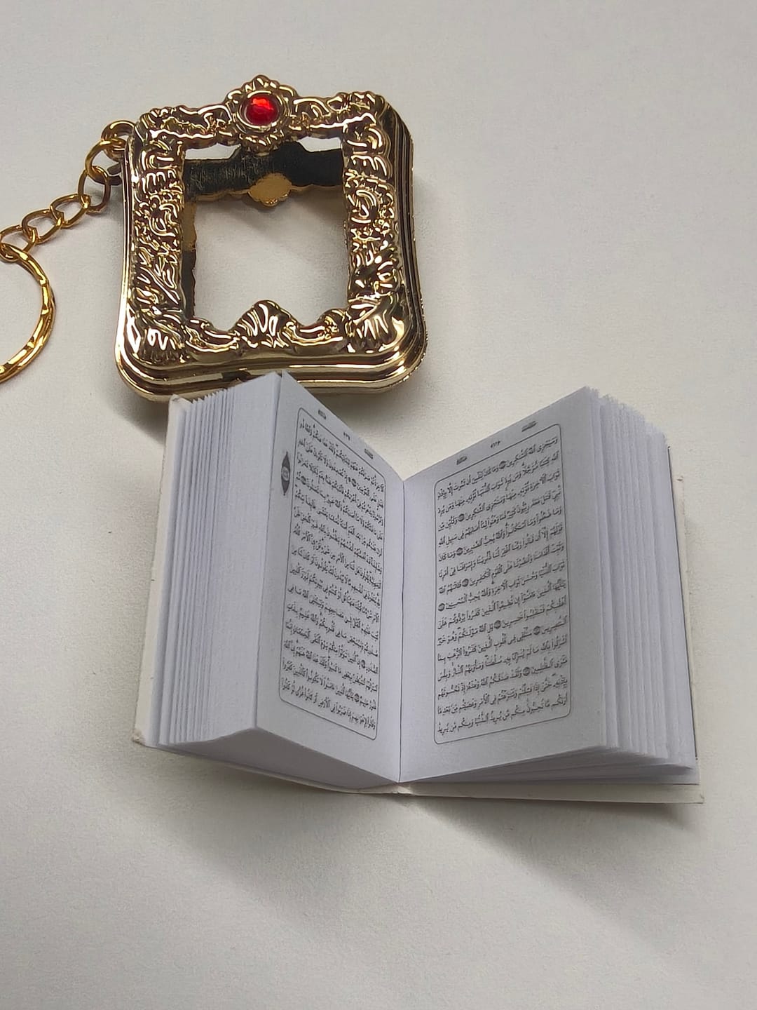 Customer photo review of HilalHaven Ornate Tome Decorative Mini Quran Keychain