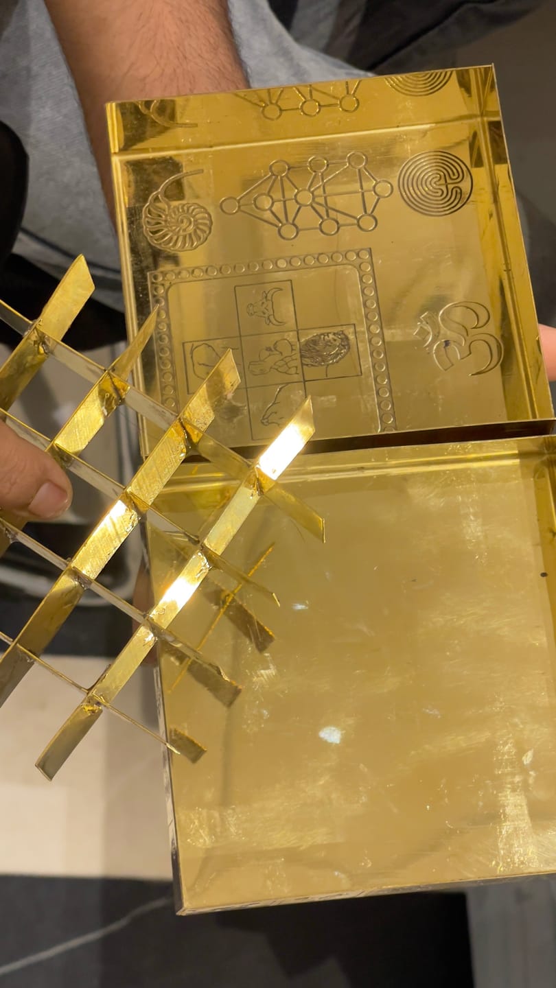 Customer photo review of Brass Manjusha Yantra Box with Partition – Vastu Remedy for Brahmasthan Correction | 16-Compartment Energy Organizer with 45 Devta Symbols | 5 & 9 Inch Sizes