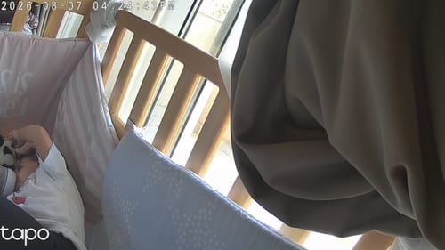Customer's child sleeping on the Soft Foam Baby Cot Bed Mattress in a crib.