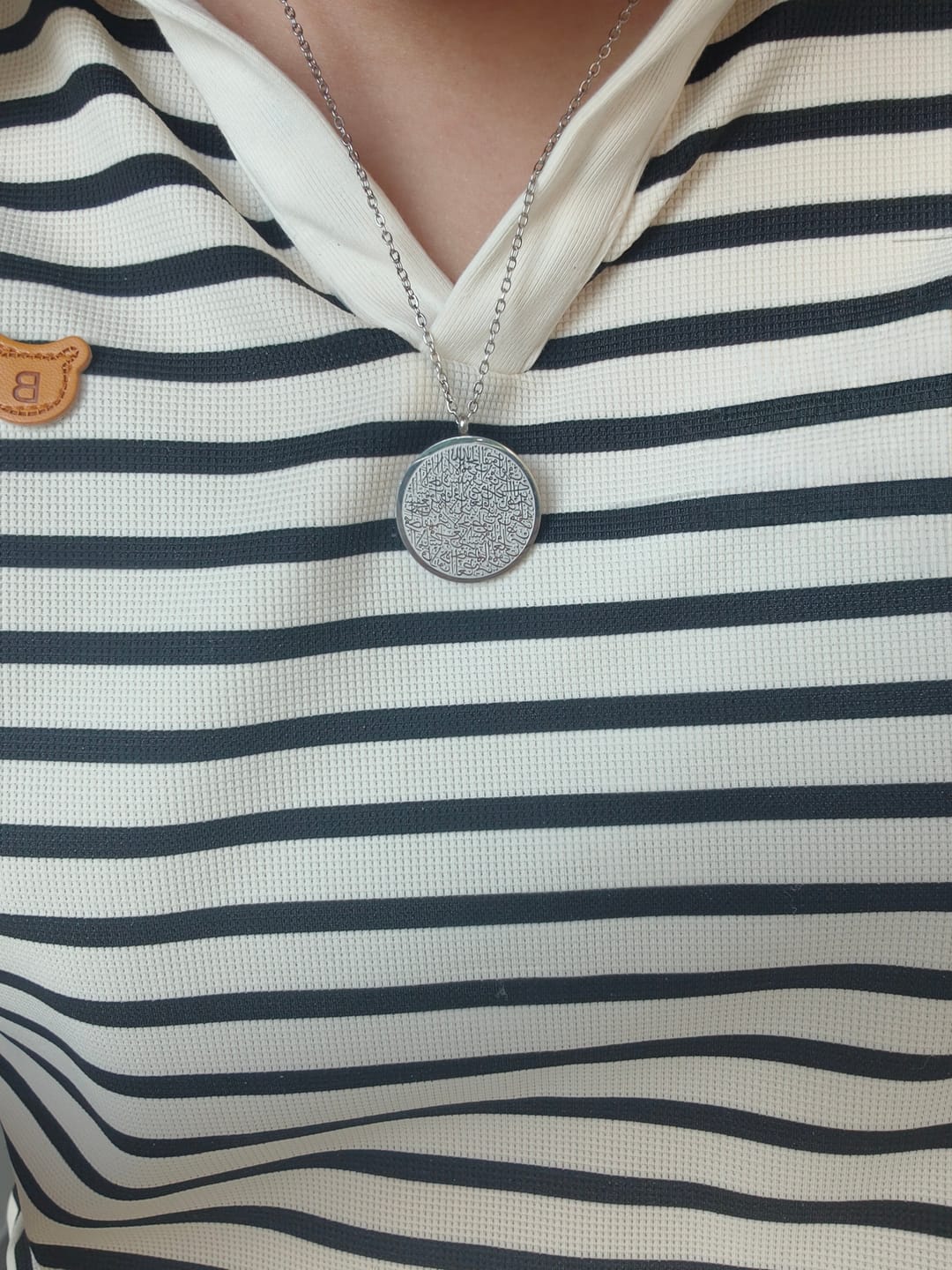 Customer photo review of HilalHaven Inner Peace Ayatul Kursi Script Necklace — Polished Daily Wear Pendant