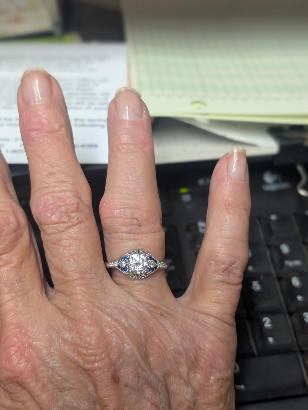 Customer photo review of Art Deco Gallery Vintage Moissanite Milgrain & Blue Accent Engagement Ring