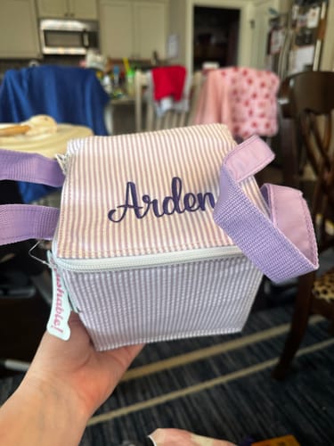 Customer's Snack Square bag in striped fabric with the name Arden monogrammed on the front