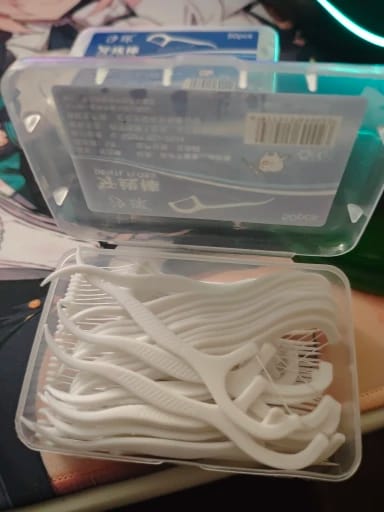Customer photo review of 50/100PCS Portable Disposable Dental Floss Picks Deep Clean Interdental Sticks Daily Oral Care Travel Teeth Cleaning Tool Set