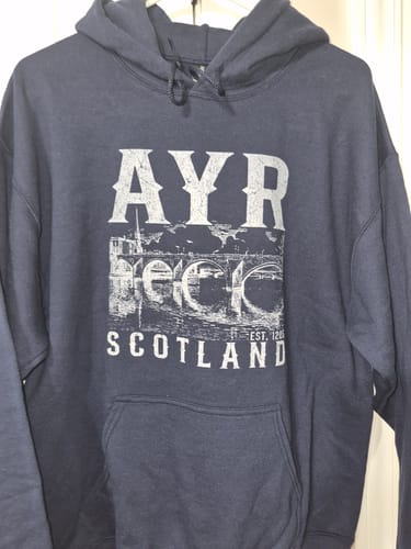 Customer's navy blue Ayr Scotland Sketch Hoodie showing a graphic of the medieval bridge