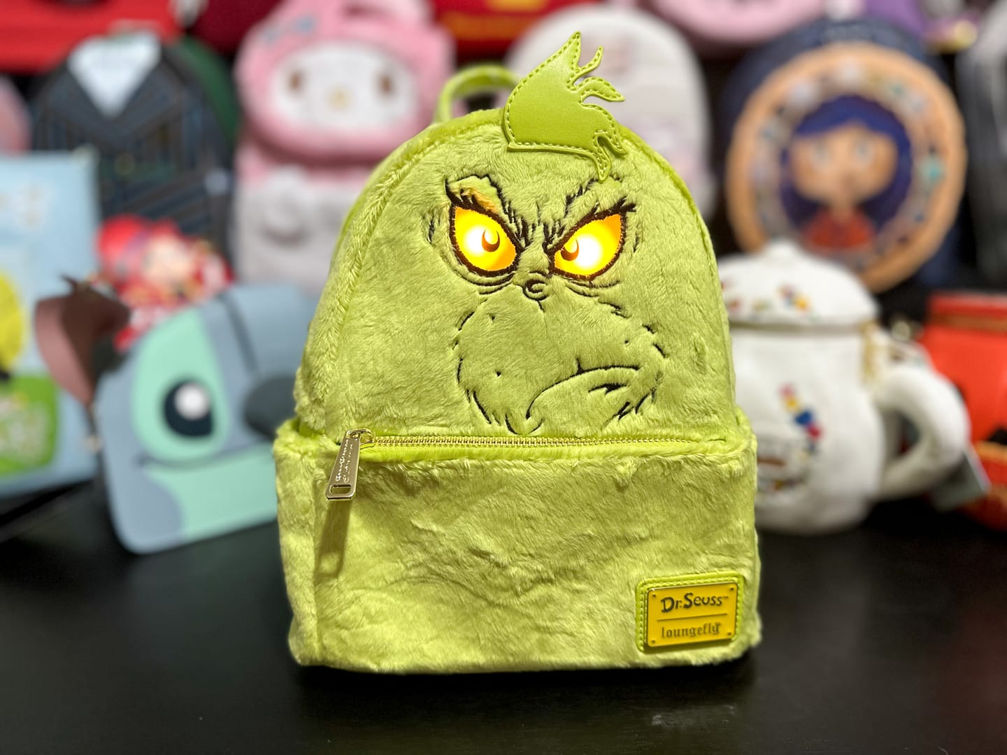 Customer photo review of Loungefly Dr Seuss Plush Grinch Light Up Cosplay Mini Backpack