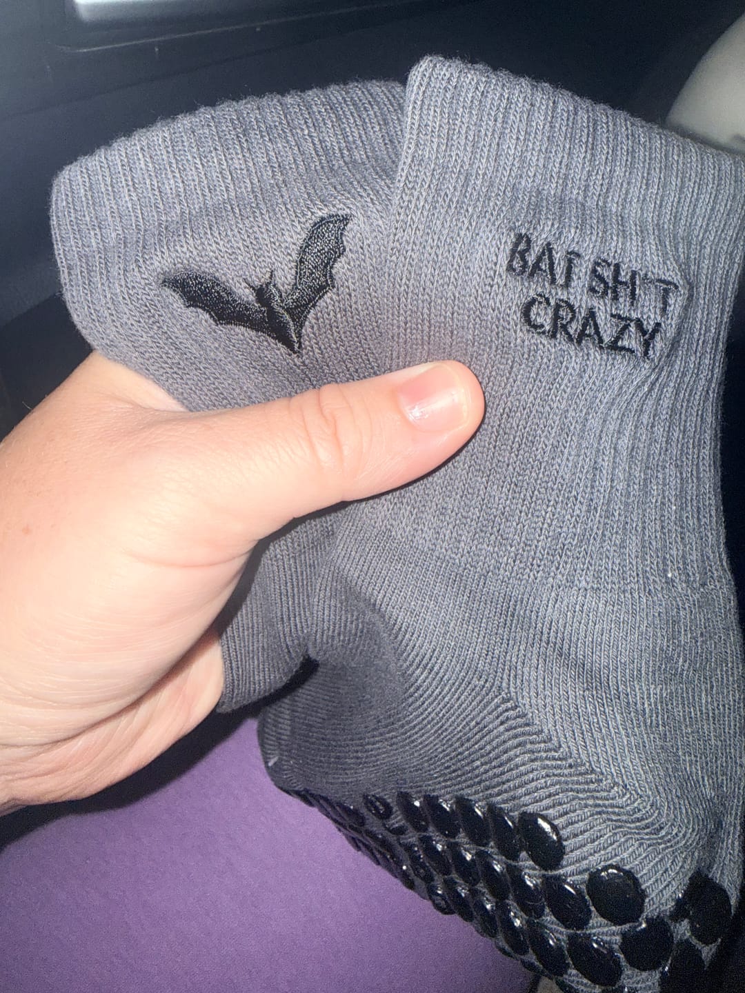 Customer photo review of Bat Sh*t Crazy Halloween Grip Socks