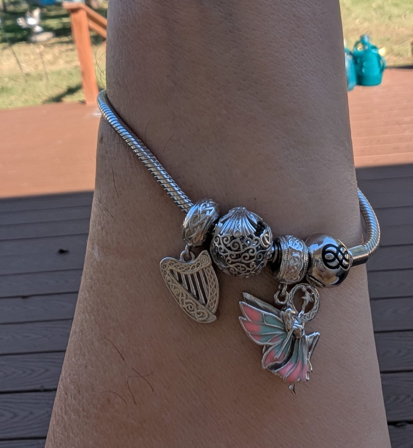 Customer photo review of Dance of the Sidhe™ Charm — 18K White Gold | Mother of Pearl