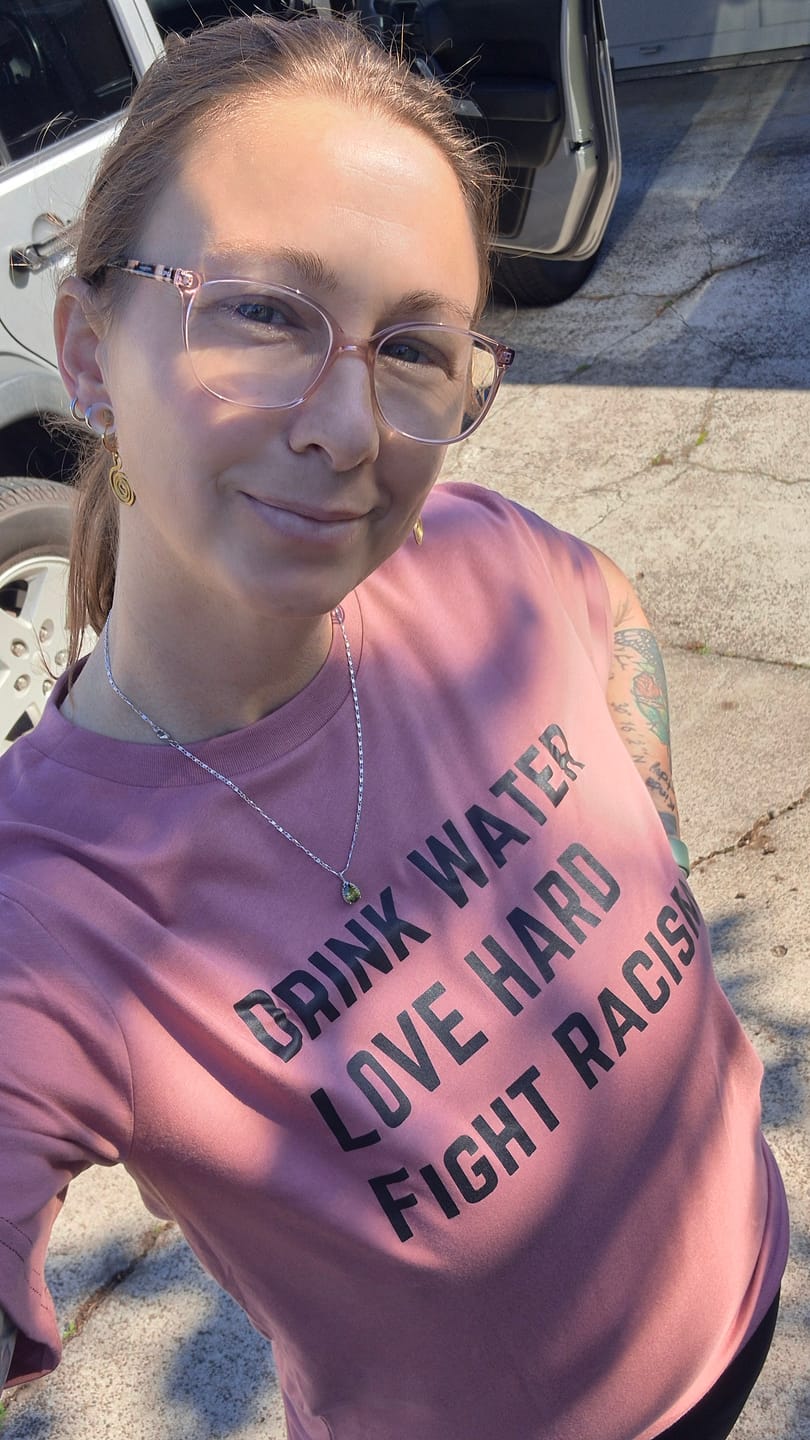 Customer photo review of Drink Water Fight Racism Unisex T-shirt