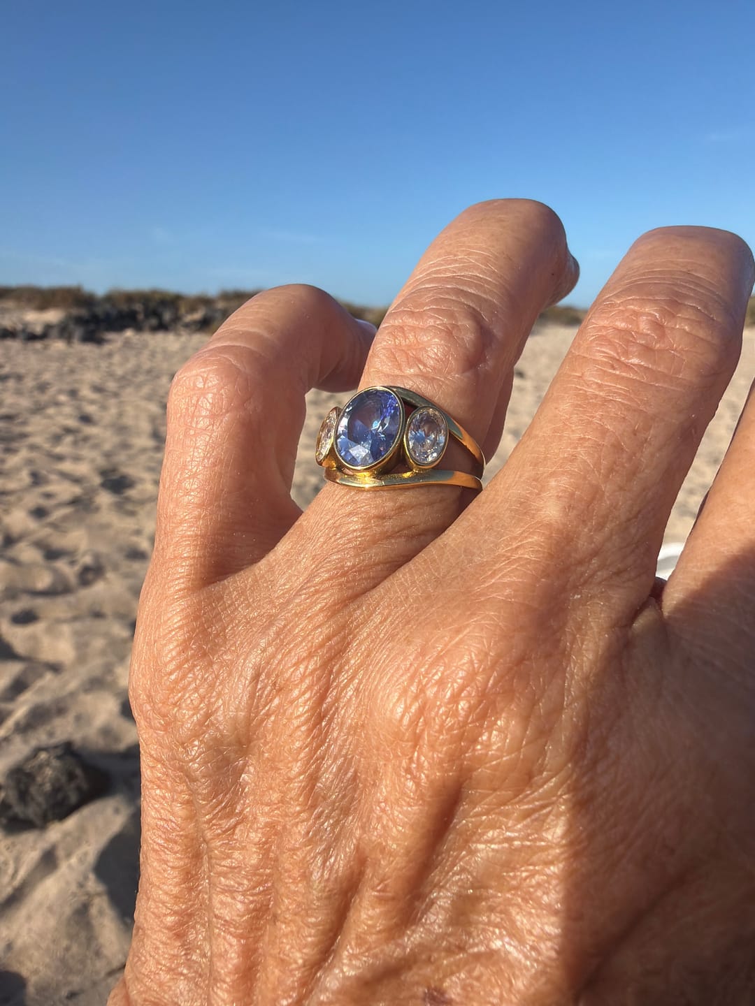 Customer photo review of Bezel Trilogy Ring Tanzanite
