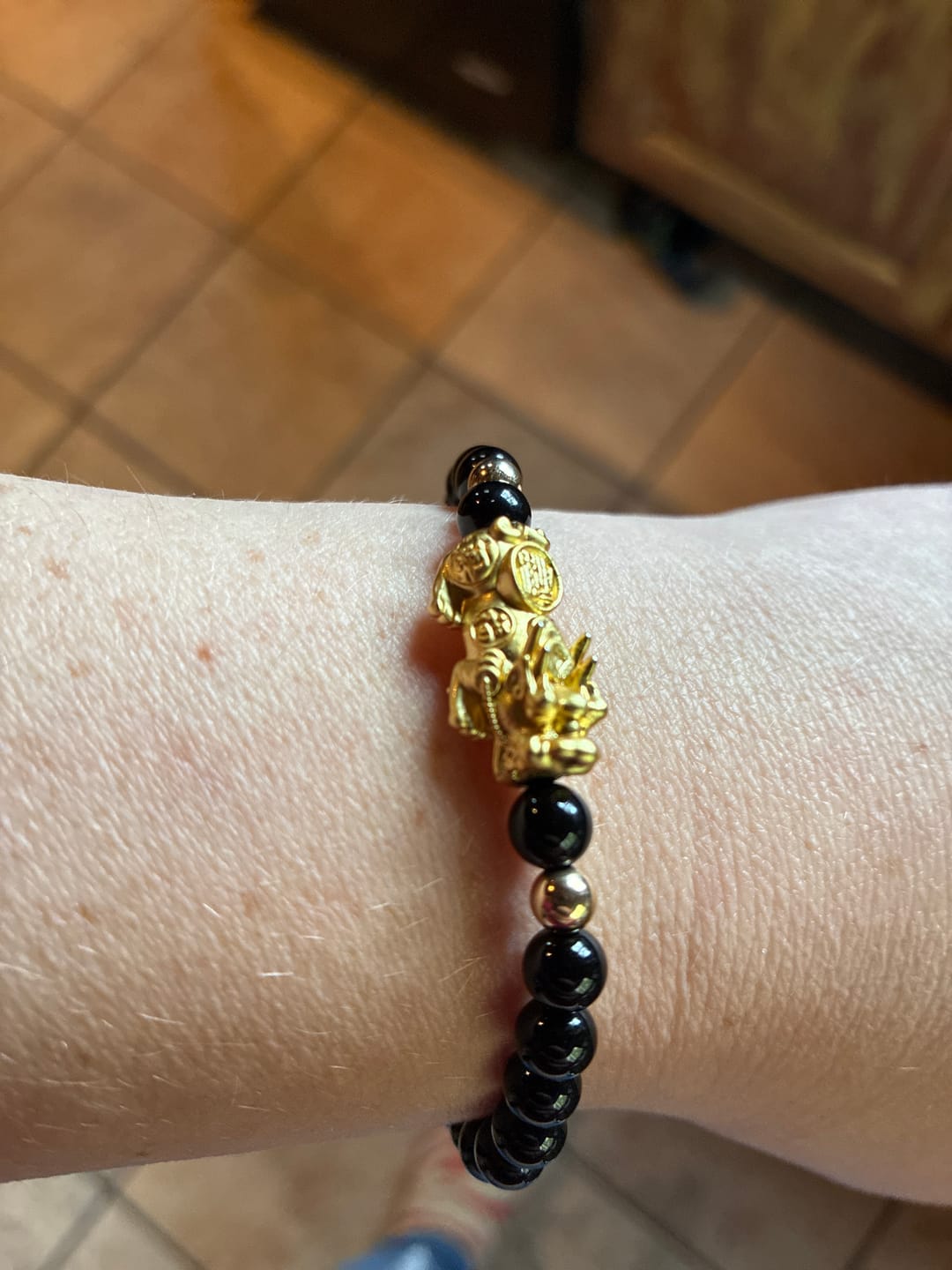 Customer photo review of Black Obsidian Unlimited Prosperity 18K Gold Vermeil Pixiu Feng Shui Bracelet