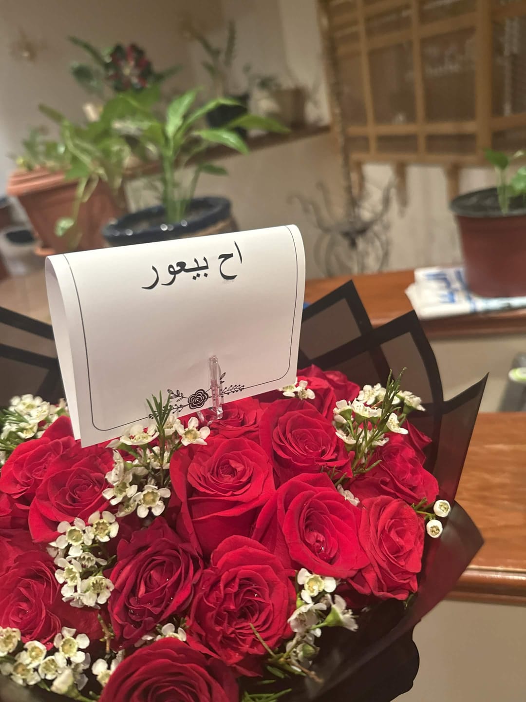 Customer photo review of Red rose hand bouquet with white vex