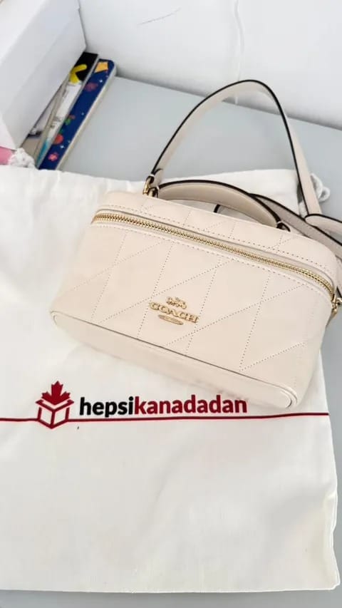 Customer photo review of Coach Women's Rainer Crossbody Bag 18 With Quilting Gold/Chalk