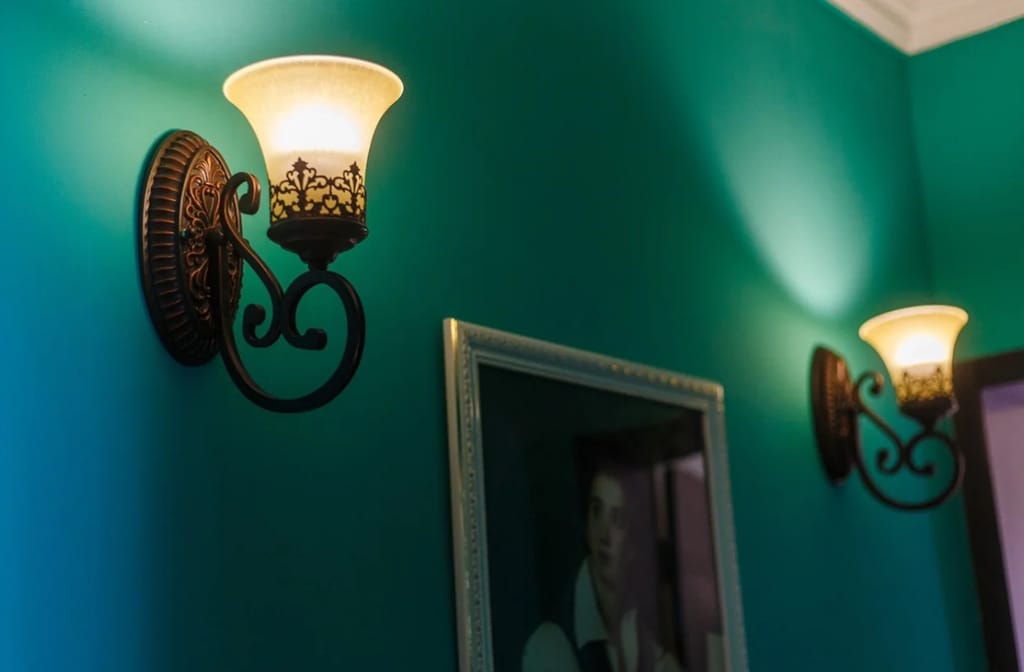 Customer photo review of Black Iron Wall Light, Two Arms, Glass Shades, Wall Sconce