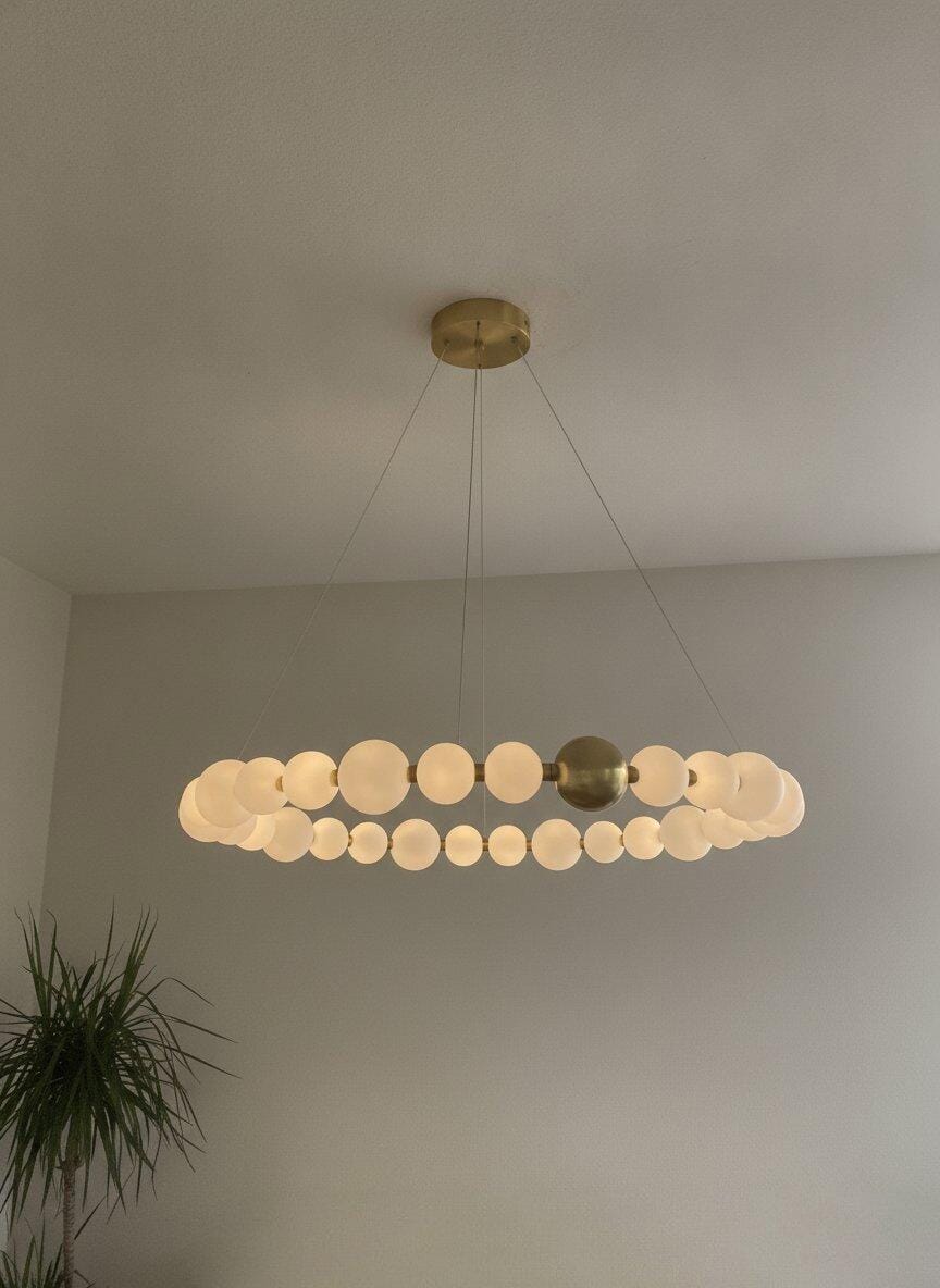 Customer photo review of White Acrylic Globe Pendant Light, Brass Finish, 42 to 102 cm