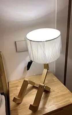 Customer photo review of Wooden Humanoid Table Lamp, Adjustable Wood Frame, Fabric Shade, 44 cm