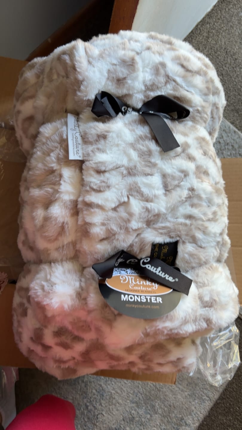 Customer photo review of Hugs Snow Leopard Blanket