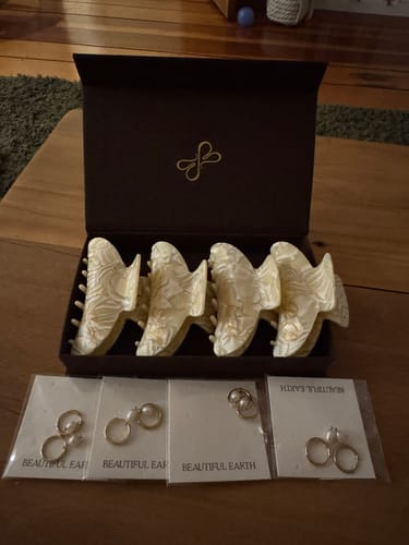 Customer's Freshwater Pearl Bella Hoop Earrings in packaging, alongside hair clips in a branded gift box.