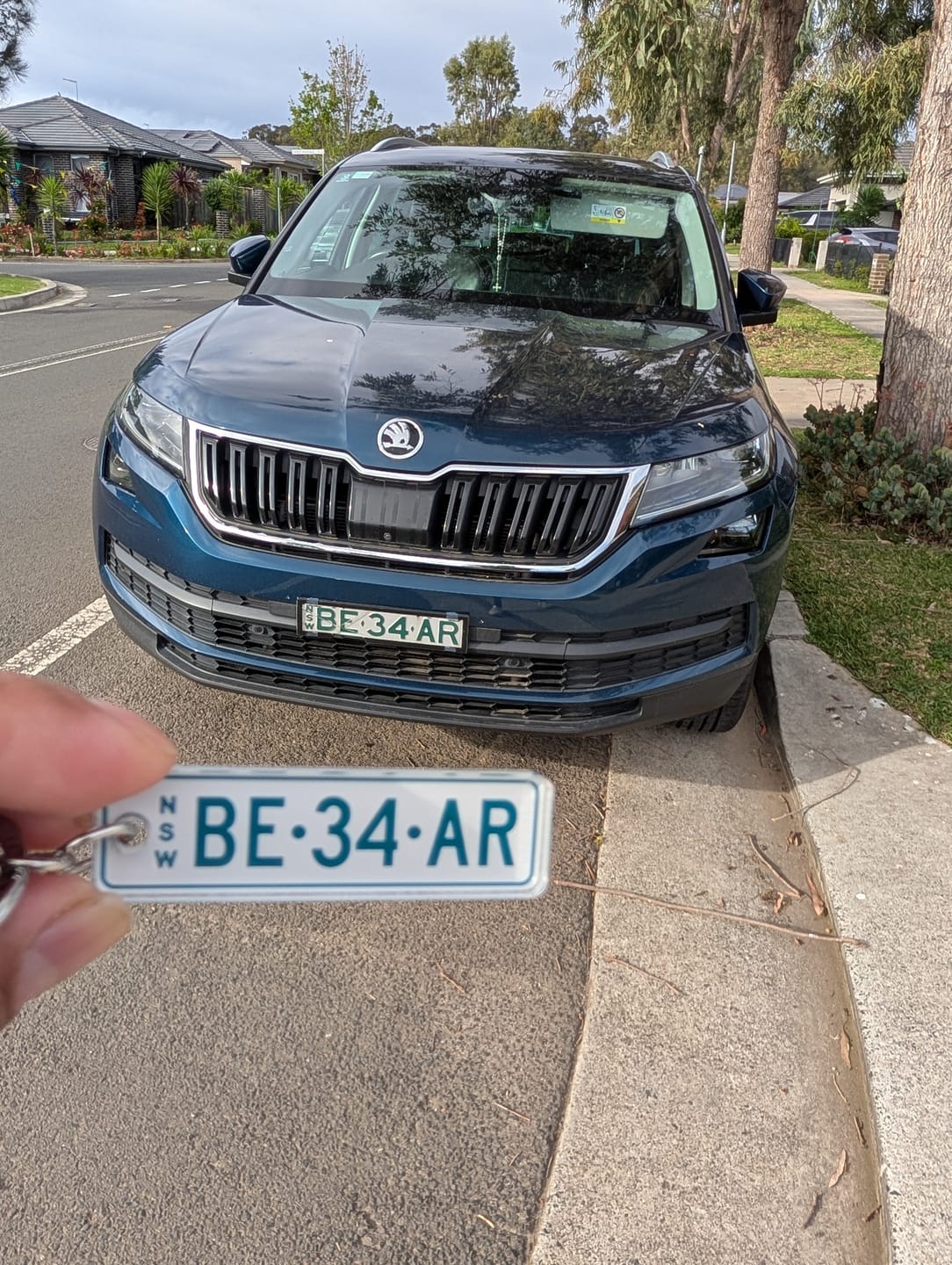 Customer photo review of NSW Colour on White Licence Plate Custom Keychain