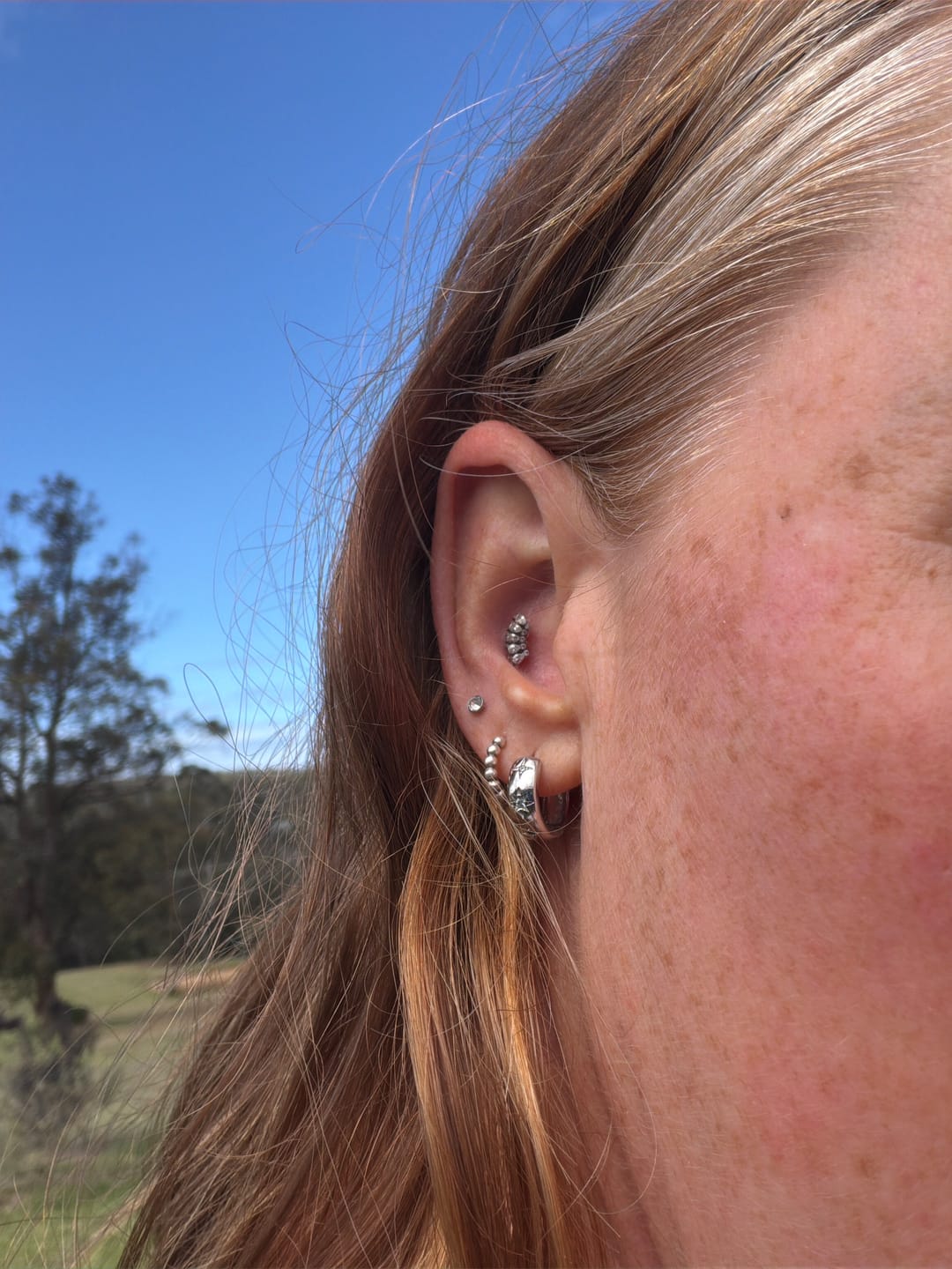 Customer photo review of North Star Thick Huggie Earrings