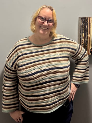 Customer wearing an Open Stitch Multi-Color Crew Neck Striped Sweater with a relaxed fit and long sleeves.