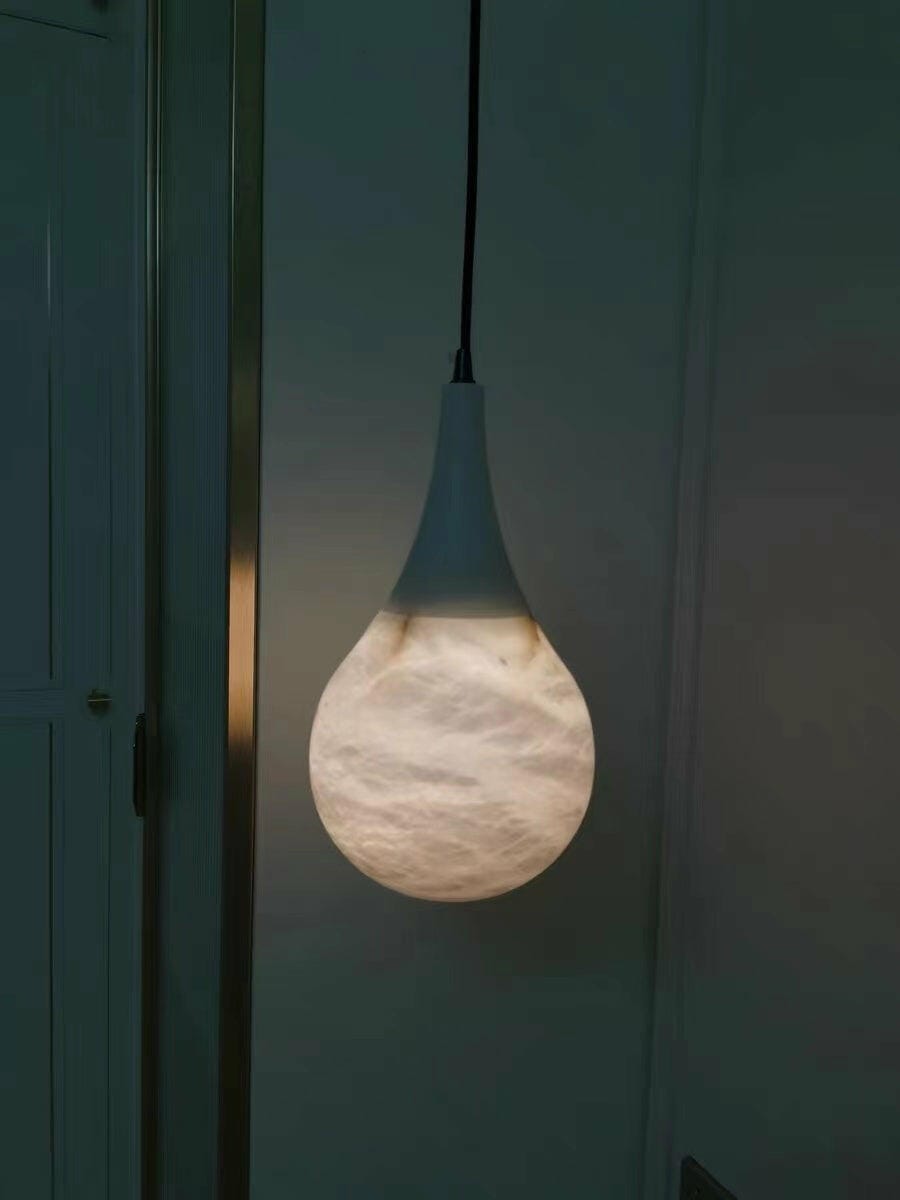 Customer photo review of Teardrop Alabaster Pendant Light, Black Cord, Brass Tip