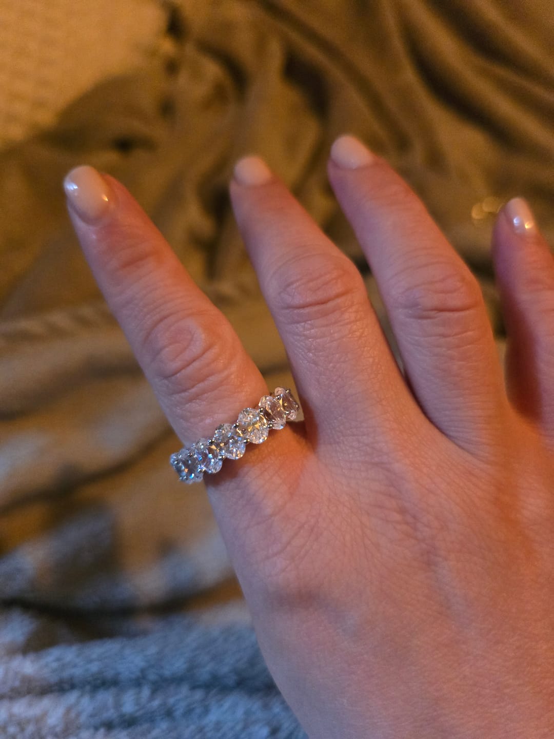 Customer photo review of Oval Cut Sapphire Eternity Sterling Silver Wedding Band