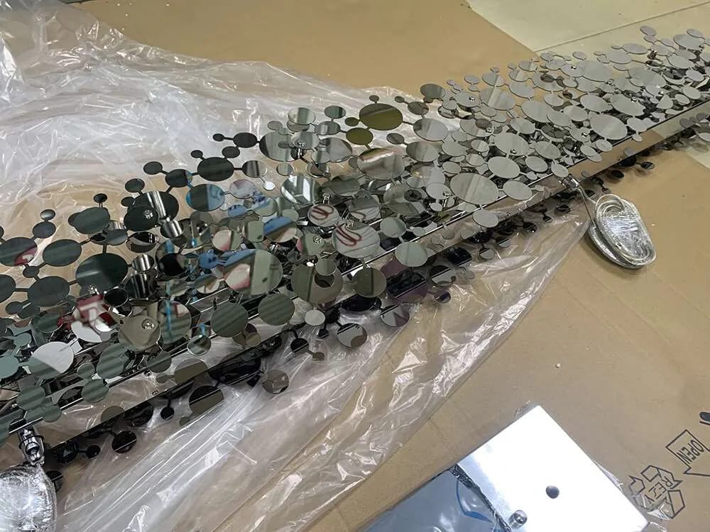 Customer photo review of Linear Chandelier, Cloud of Metallic Discs, Stainless Steel, 80–150 cm