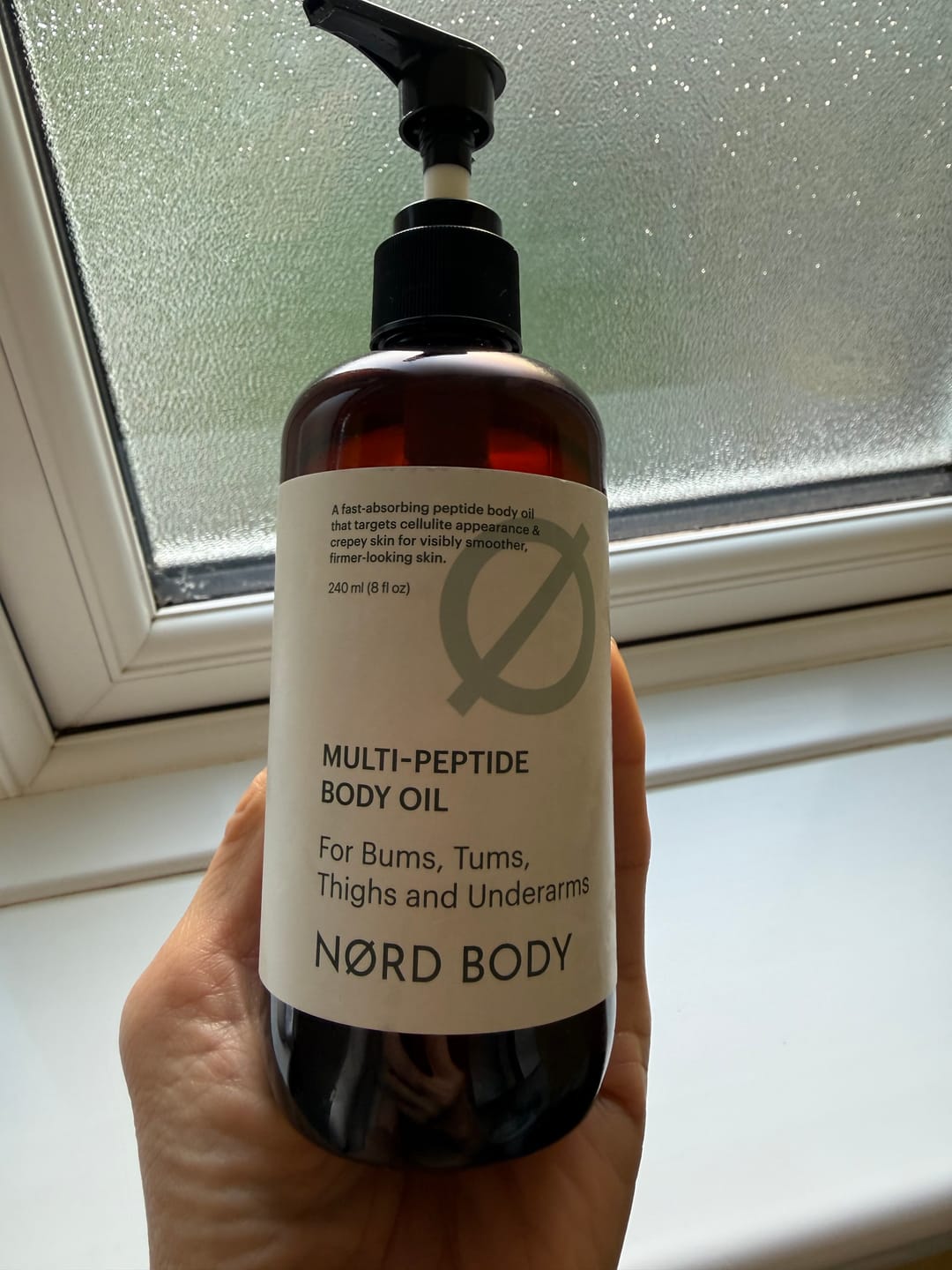 Customer photo review of NØRD BODY Peptide Body Oil