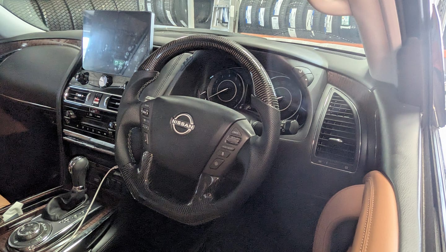 Customer photo review of Nissan Patrol Y62 2012-2024 Premium Steering Wheel - Genuine Perforated Leather & Carbon Fiber