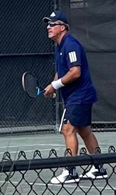 Customer's CUURT Muuv court shoes worn while playing tennis on an outdoor court.