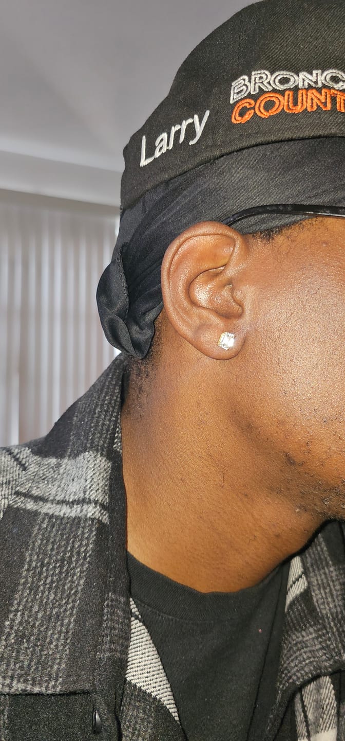 Customer photo review of Emerald Cut Moissanite VVS D Stud Earrings .925 Sterling Silver