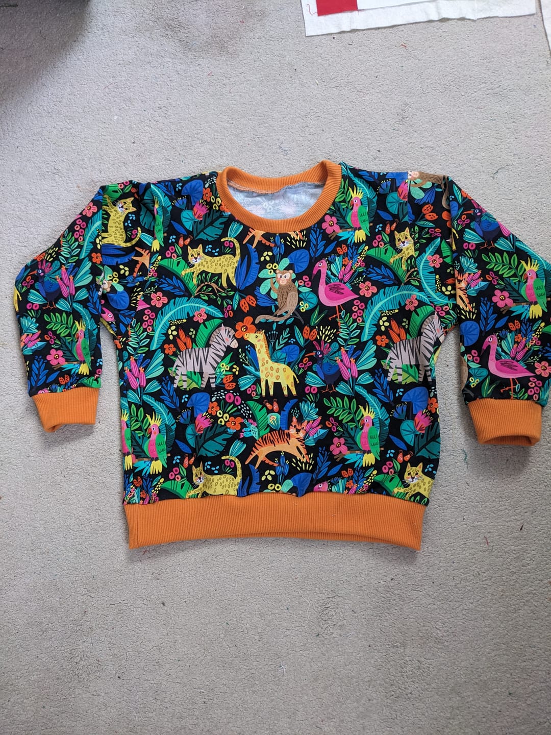 Customer photo review of Animal Jungle on Black French Terry Fabric