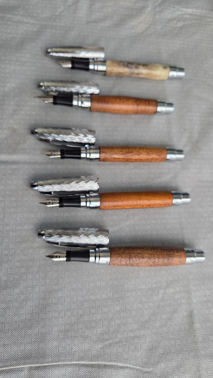 Customer photo review of Combo Pack of 14 Pen Blanks - 3/4" x 3/4" x 6” (Teak, Mango, Osage Orange, Indian Ebony, East Indian Rosewood, Indian Walnut and Mahogany)