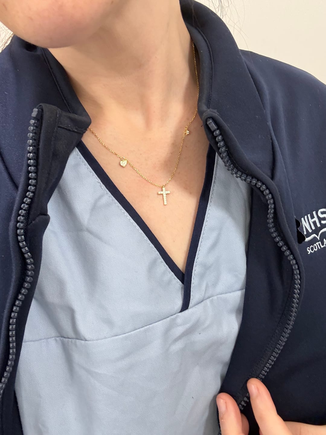 Customer photo review of Christianartworkshop Dainty Sterling Silver Paved Accent Small Cross Daily Layering Necklace: Timeless Emblem of Gentle Heavenly Guardianship