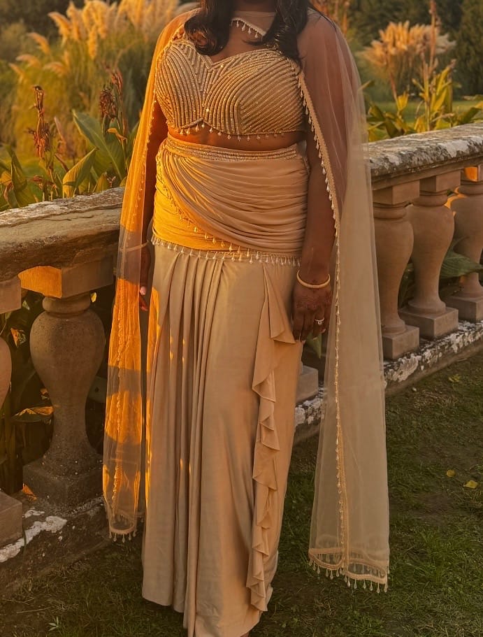 Customer photo review of Champagne Pearl Draped Cape Lehenga Set