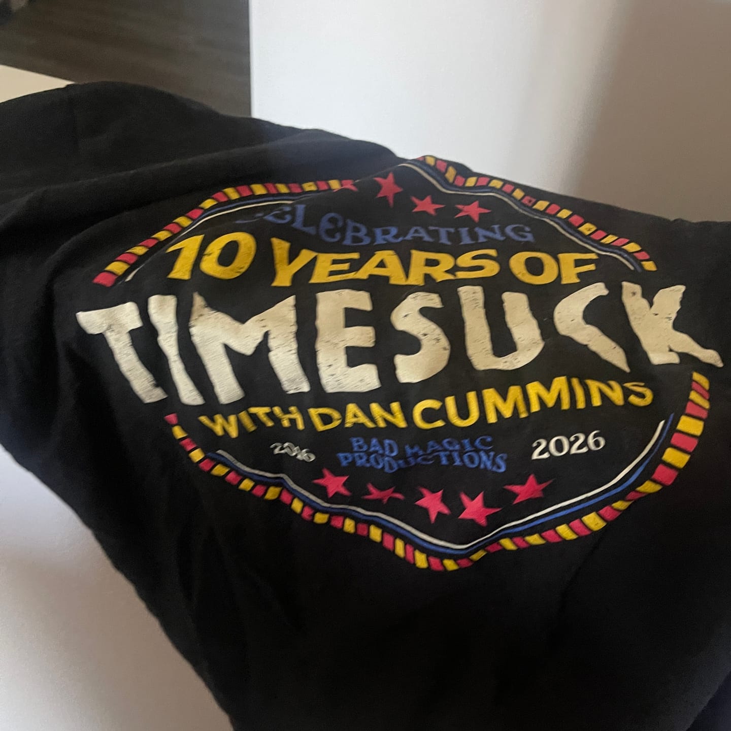 Customer photo review of Timesuck 10 Year Badge Tee