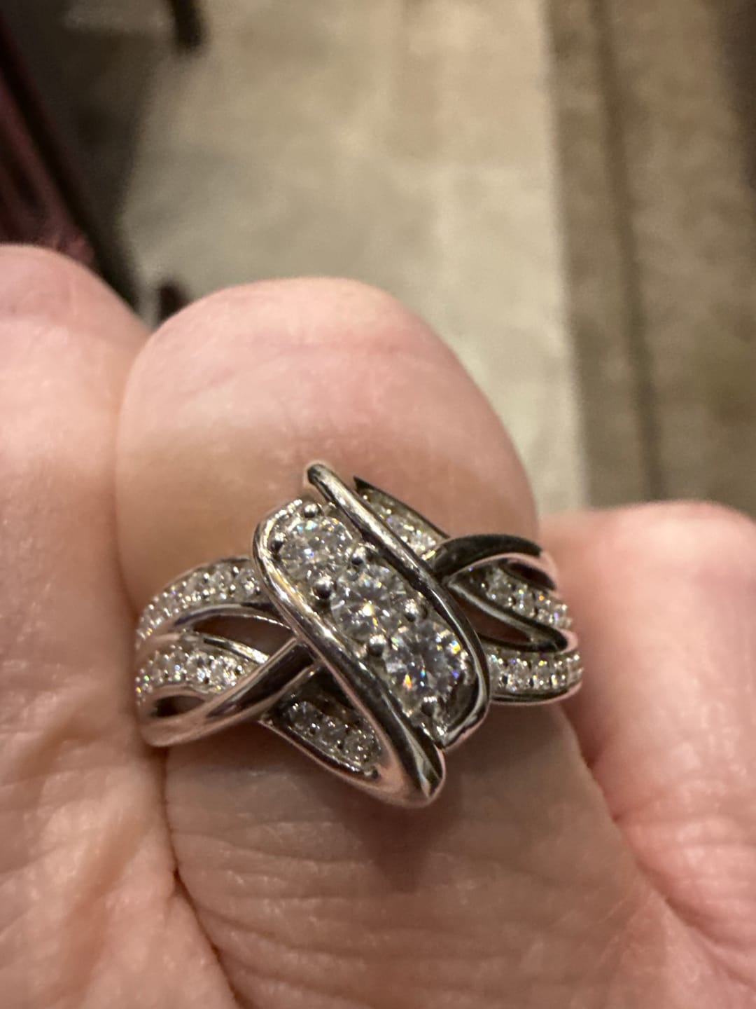 Customer photo review of Swirl Interlocking Criss-Cross Moissanite Wedding Band Ring