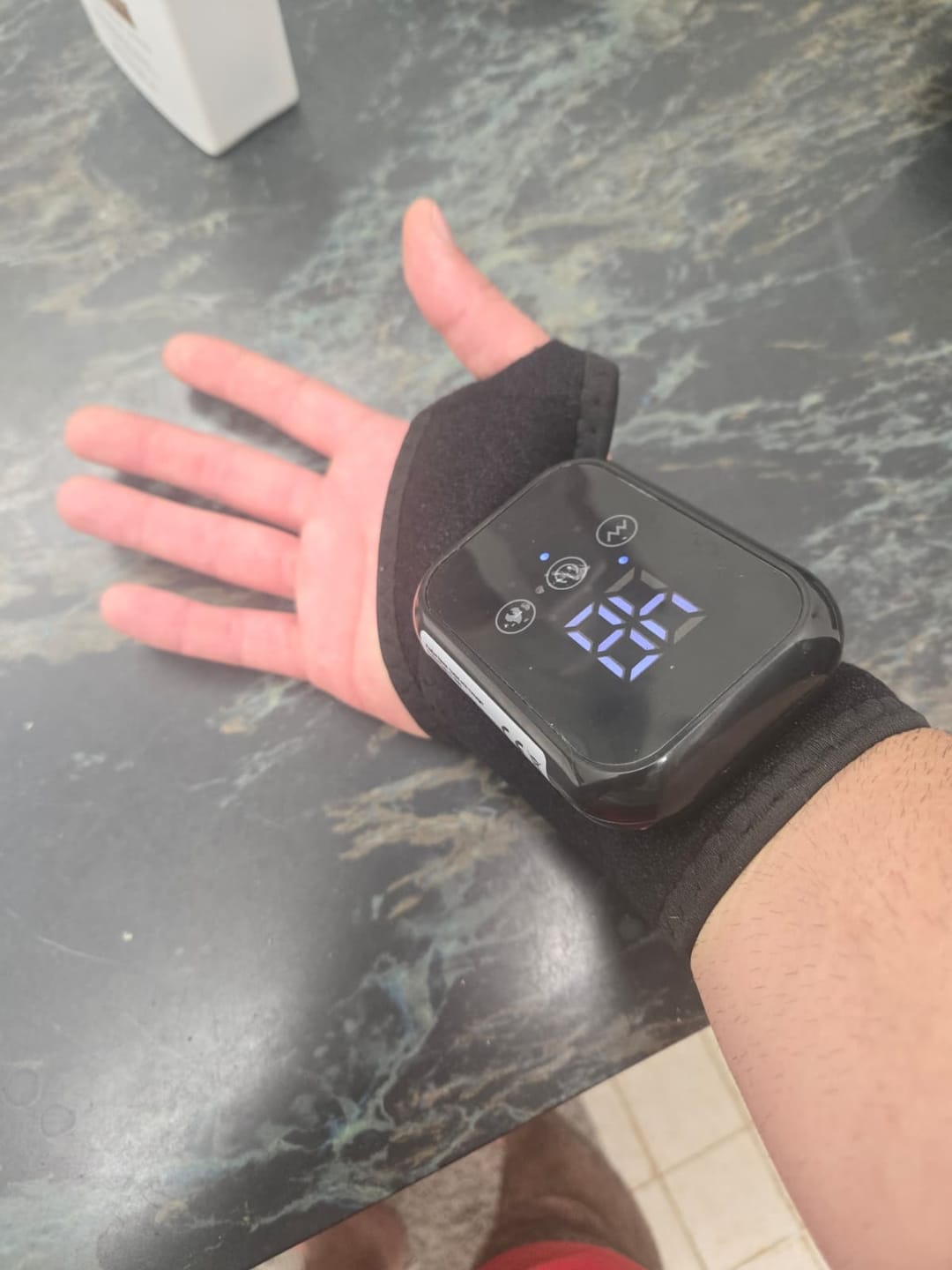 Customer photo review of Heated Wrist Wrap with Vibration Massage