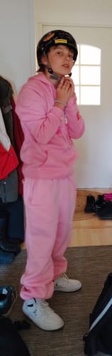 Reviewer's pink Sweat Aesthetic hoodie worn with matching pants and white sneakers.