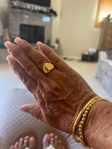Customer's gold Love Affair Heart Ring worn on their hand