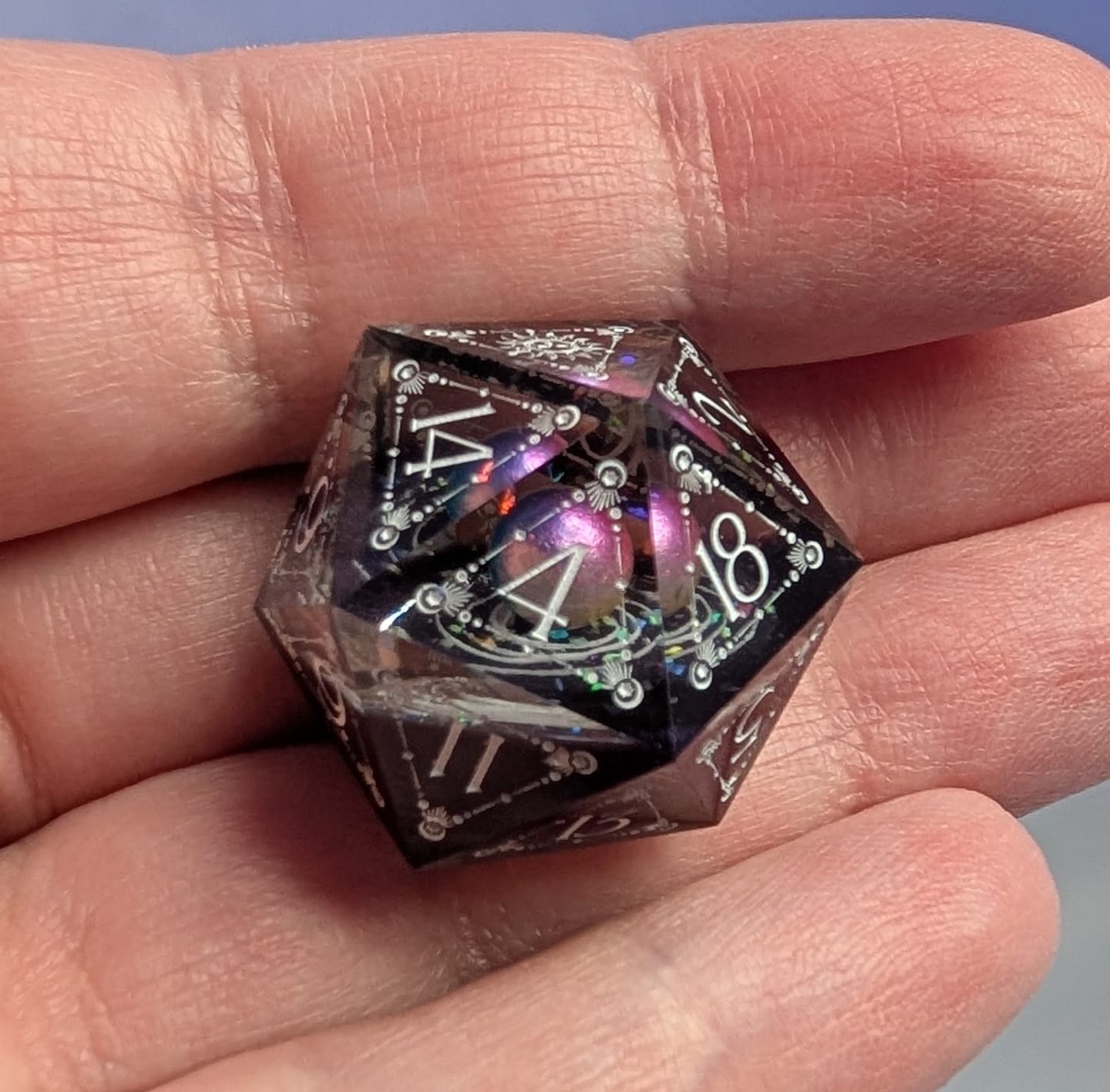 Customer photo review of URWizards D&D The Galaxy Resin Engraved Dice Set Tarot Style