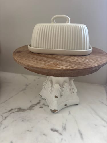Customer's Léon French Provincial cake stand featuring a wooden top and a decorative, antique white pedestal.