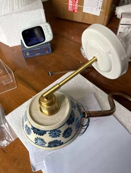 Customer photo review of Ceramic Wall Sconce with Blue Floral Shade and Brass Arm